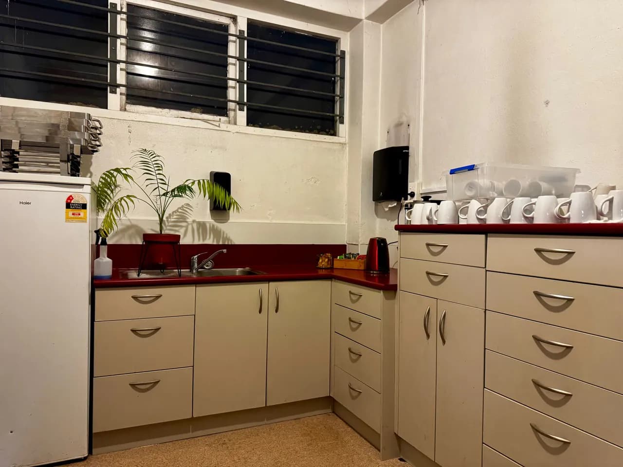 Function room kitchenette with sink, fridge and serving supplies