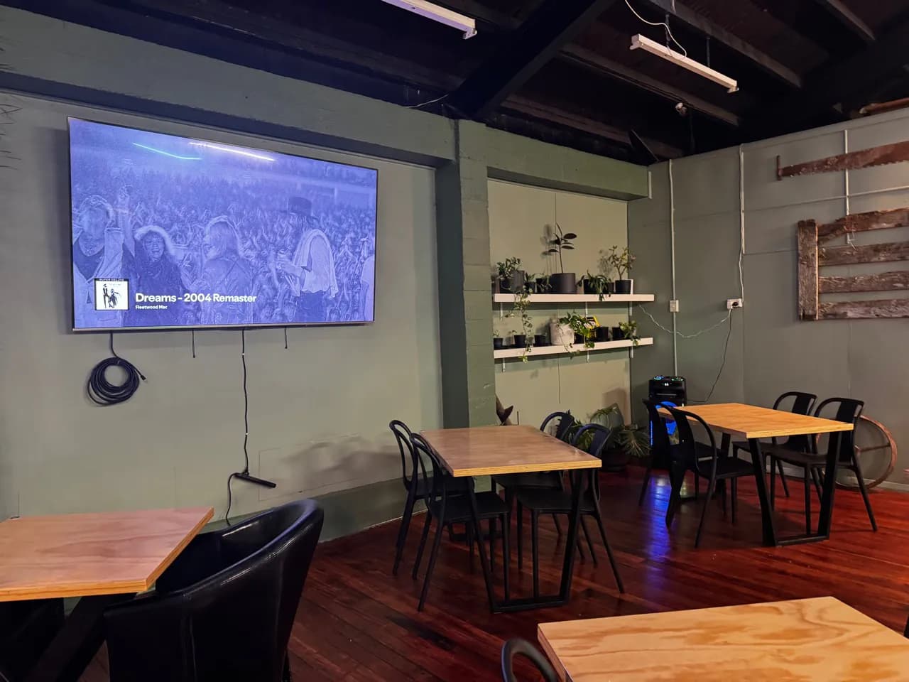 Function room seating arranged near the large television