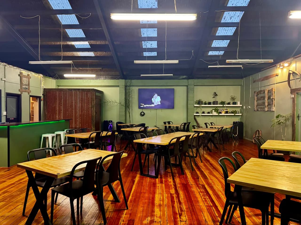 Wide view across the function room towards the television
