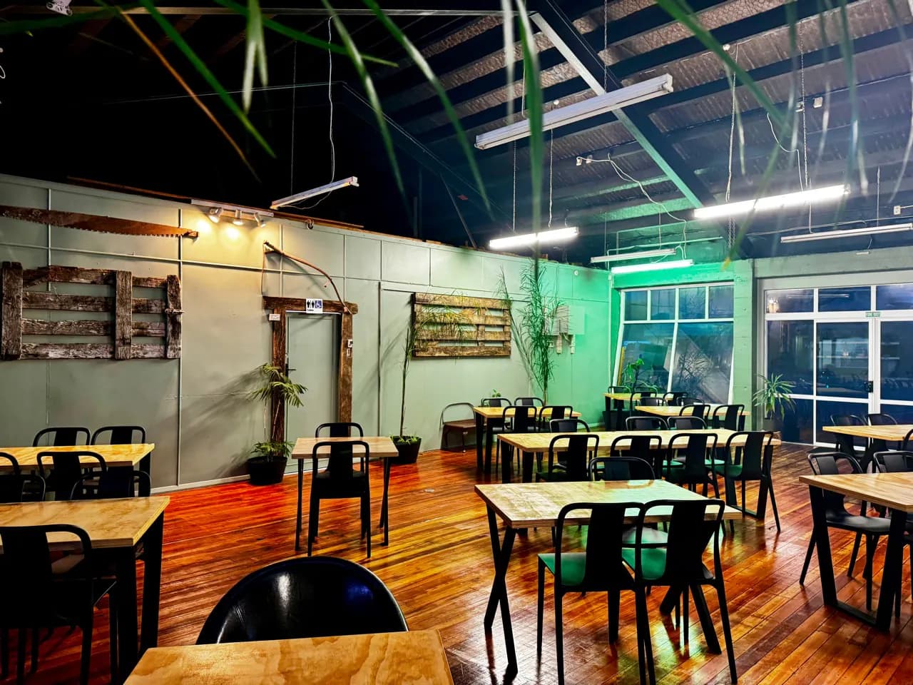 Wide room layout showing flexible table and chair arrangements
