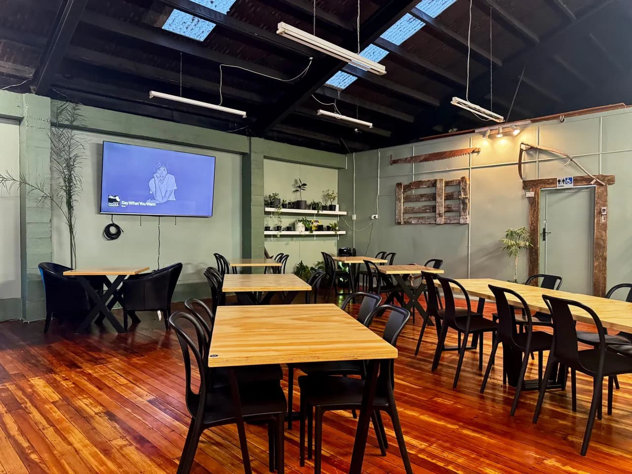 Dining tables arranged with a clear view of the television